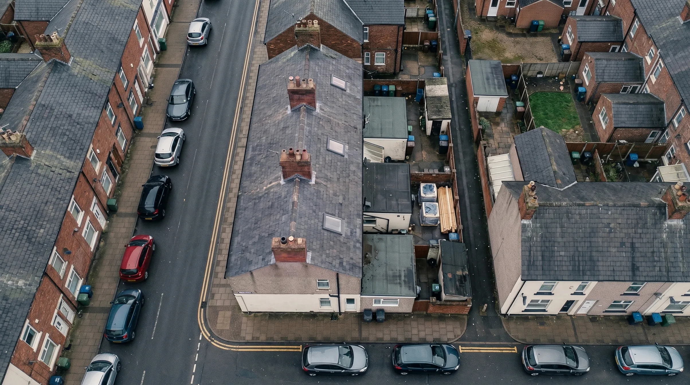 The same terrace with a new slate roof and rooflights, the scaffold down